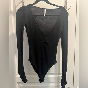 Free People Bodysuit. Black long sleeve. Breathable material. Great condition